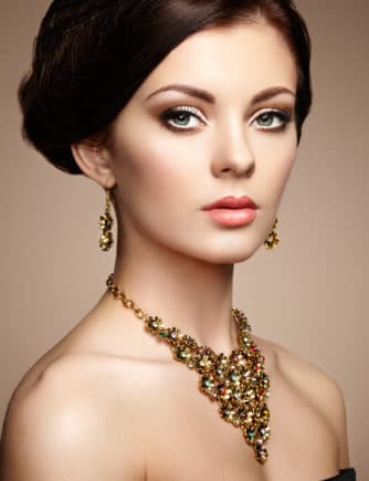 Fashion portrait of elegant woman with magnificent hair. Brunette girl. Perfect make-up